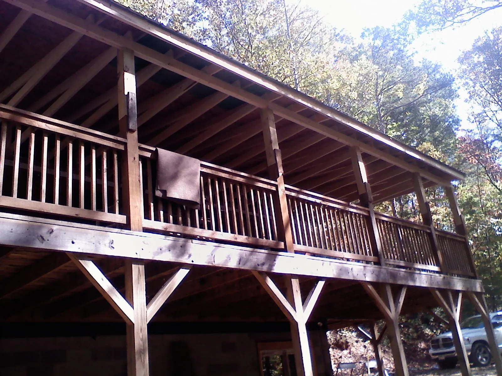 Timber framing under a new elevated porch and deck — Roof Leak Repair in New York Mills by Roofing Brothers